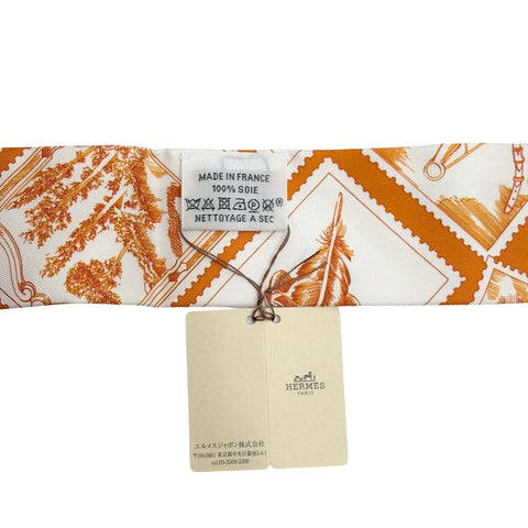 【新品未使用】 Hermes エルメス 《フォーブルの切手愛好家》 ツイリー オランジュ・キュイ/グレー/コライユ シルク100% 新品未使用